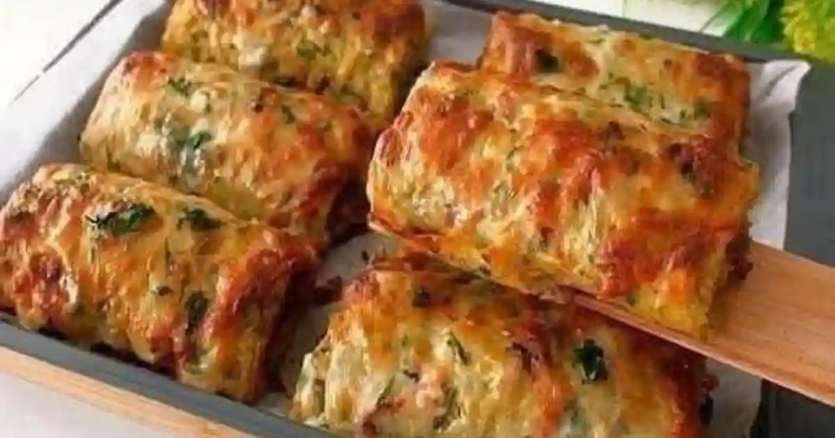Crispy Chicken Potato Rolls on a rustic wooden plate with a golden brown exterior and a tender filling